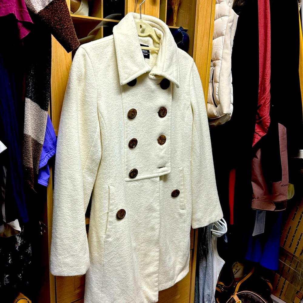 Cream pea coat 60% wool and has been freshly dry cleaned ..